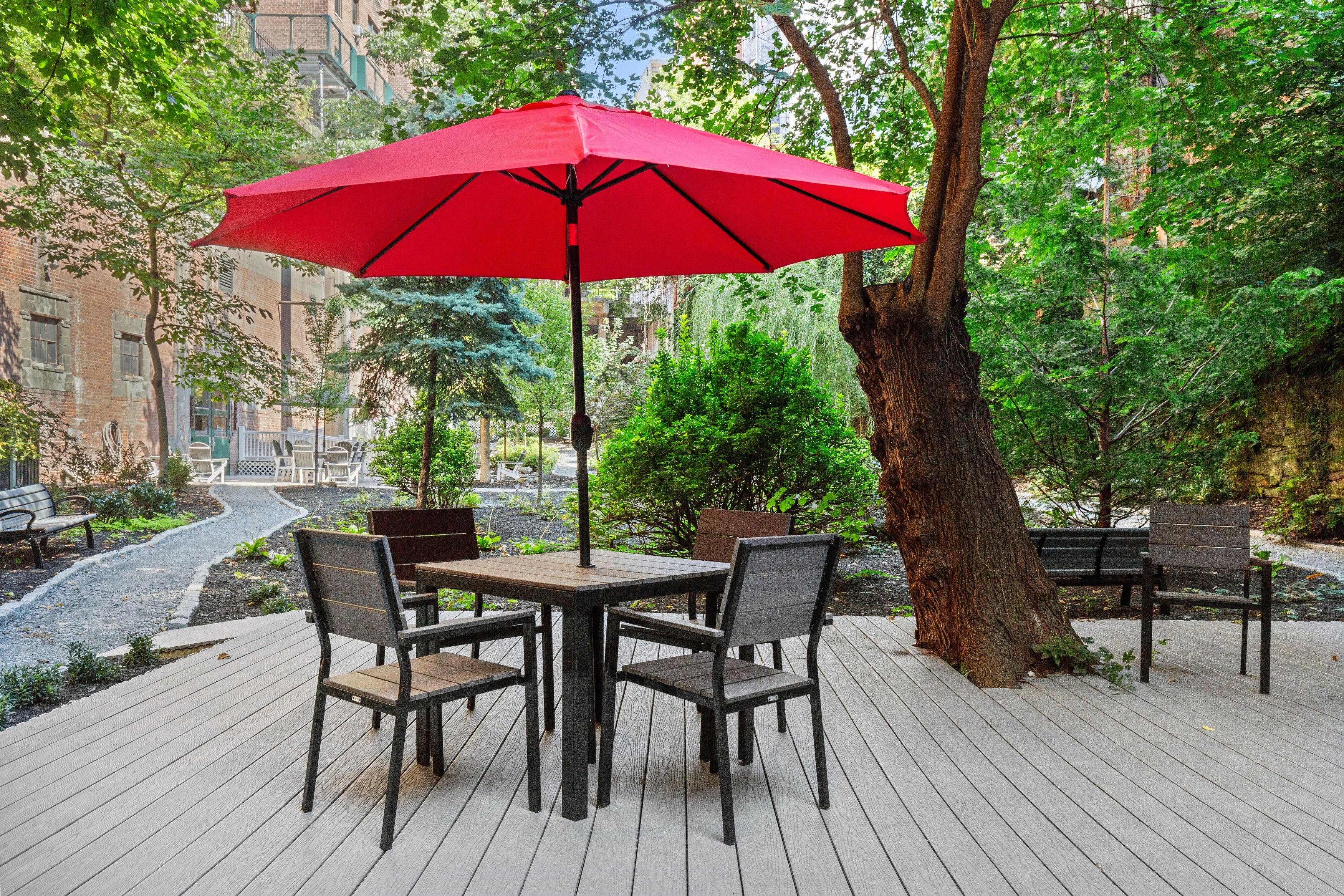 158-18 Riverside Drive West, Unit 2M Manhattan, NY 10032 - Photo 8 of 21 a view of a deck with furniture and a yard