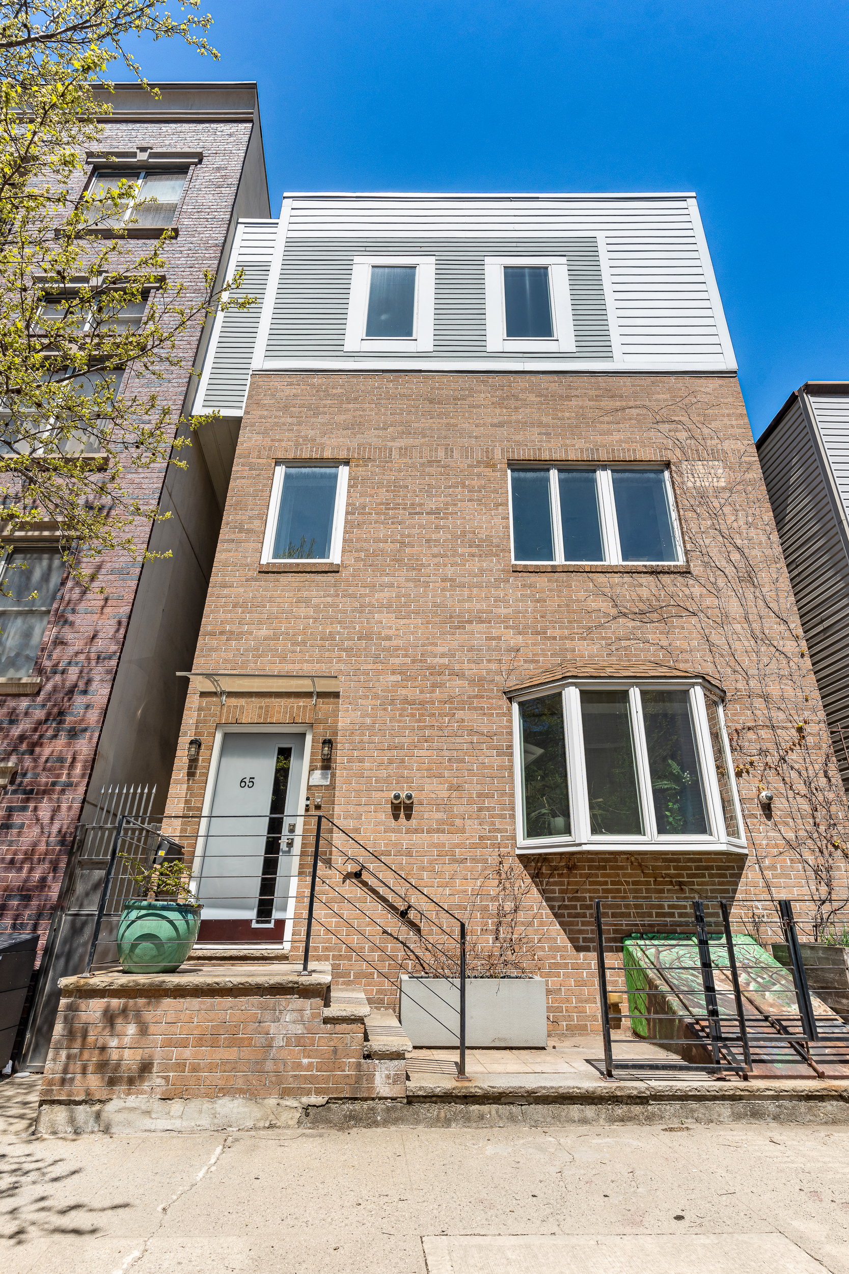 65 Jackson Street Brooklyn, NY 11211 - Photo 34 of 36 a front view of a multi story residential apartment building