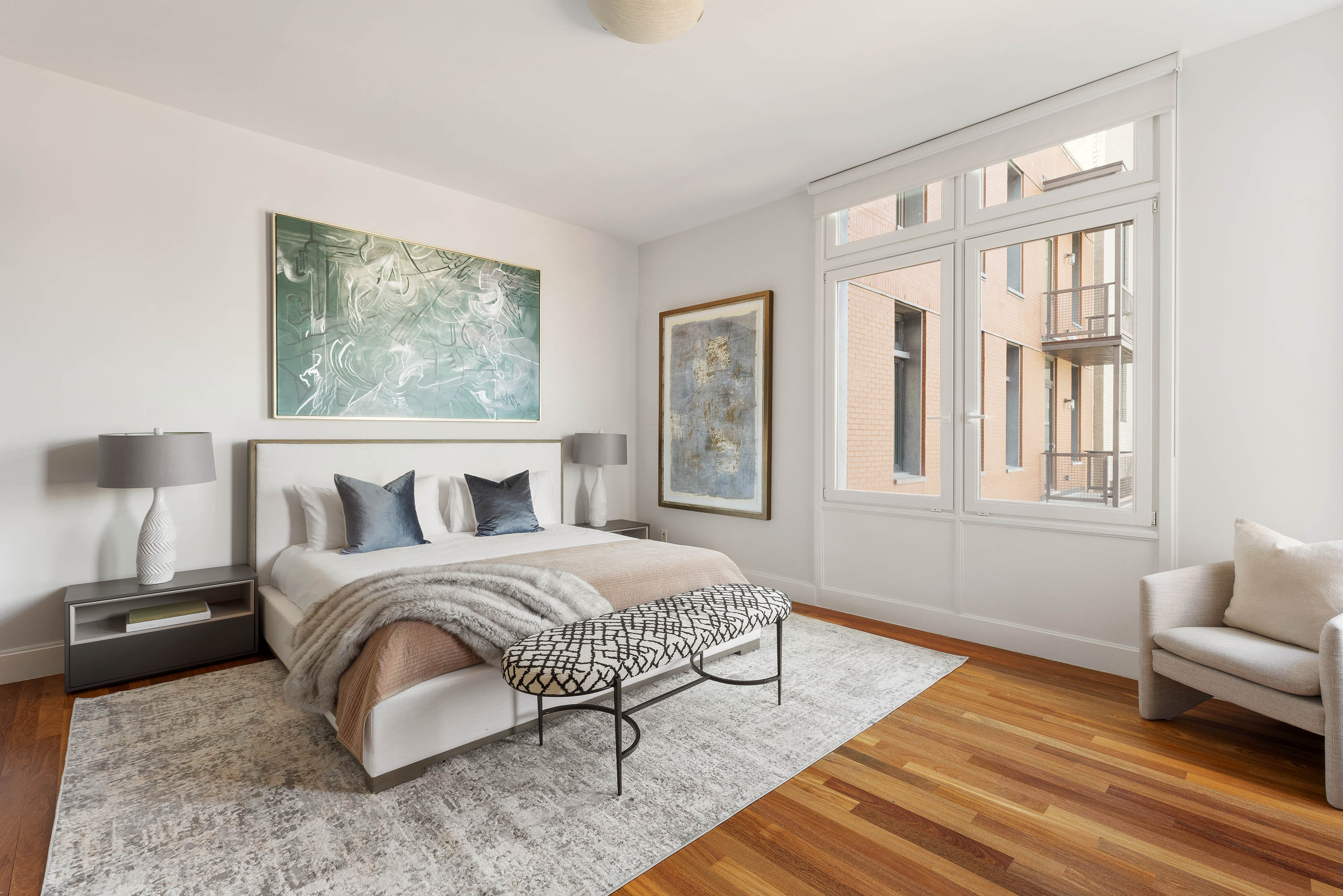 92 Laight Street, Unit 11A Manhattan, NY 10013 - Photo 6 of 15 a bedroom with a bed and a couch