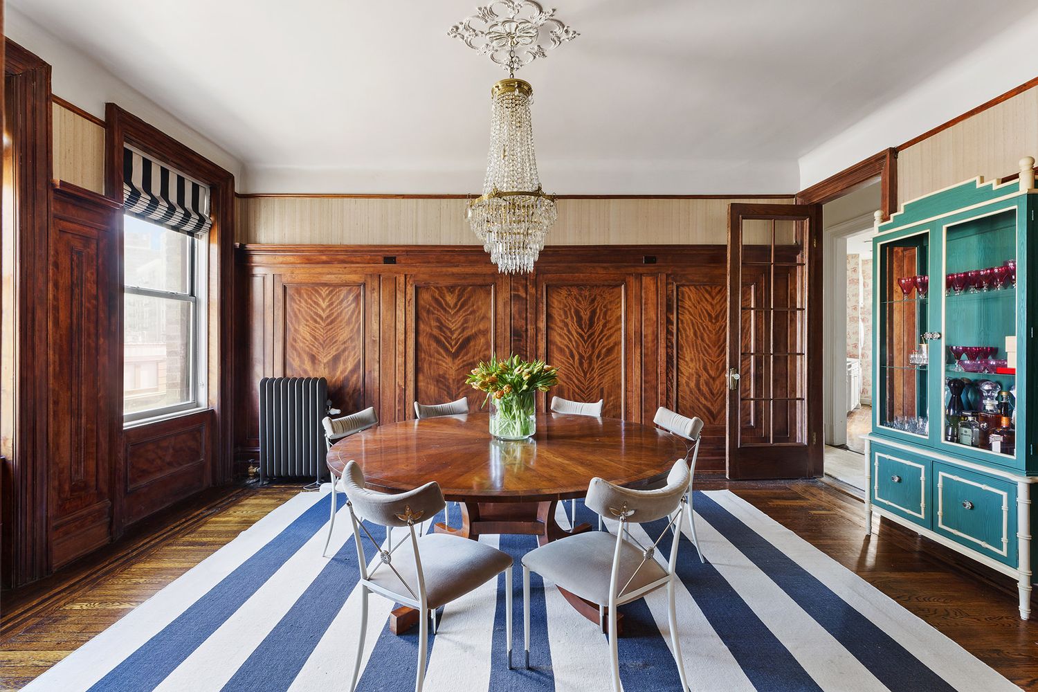 a view of a dining room with furniture window and wooden floor