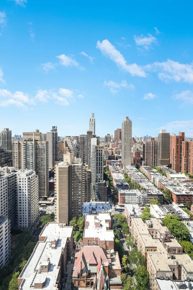 a view of a city with tall buildings in the background