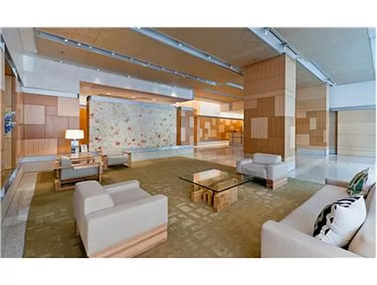 450 East 83rd Street, Unit 3A Manhattan, NY 10028 - Photo 6 of 9 a living room with furniture and a large window