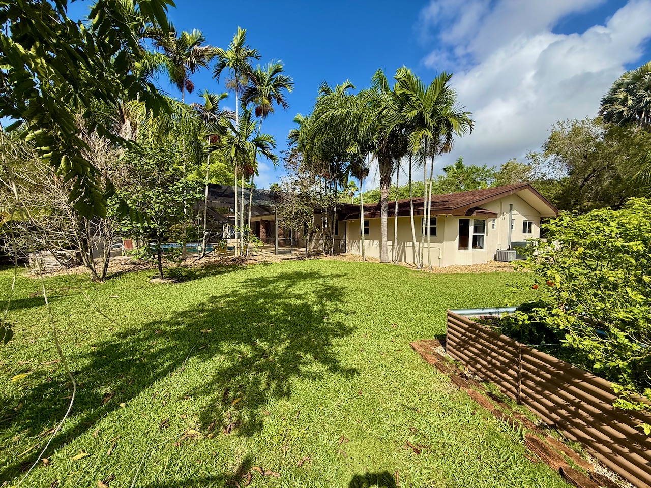 7555 Southwest 79th Avenue Miami, FL 33143 - Photo 6 of 8 a front view of a house with garden