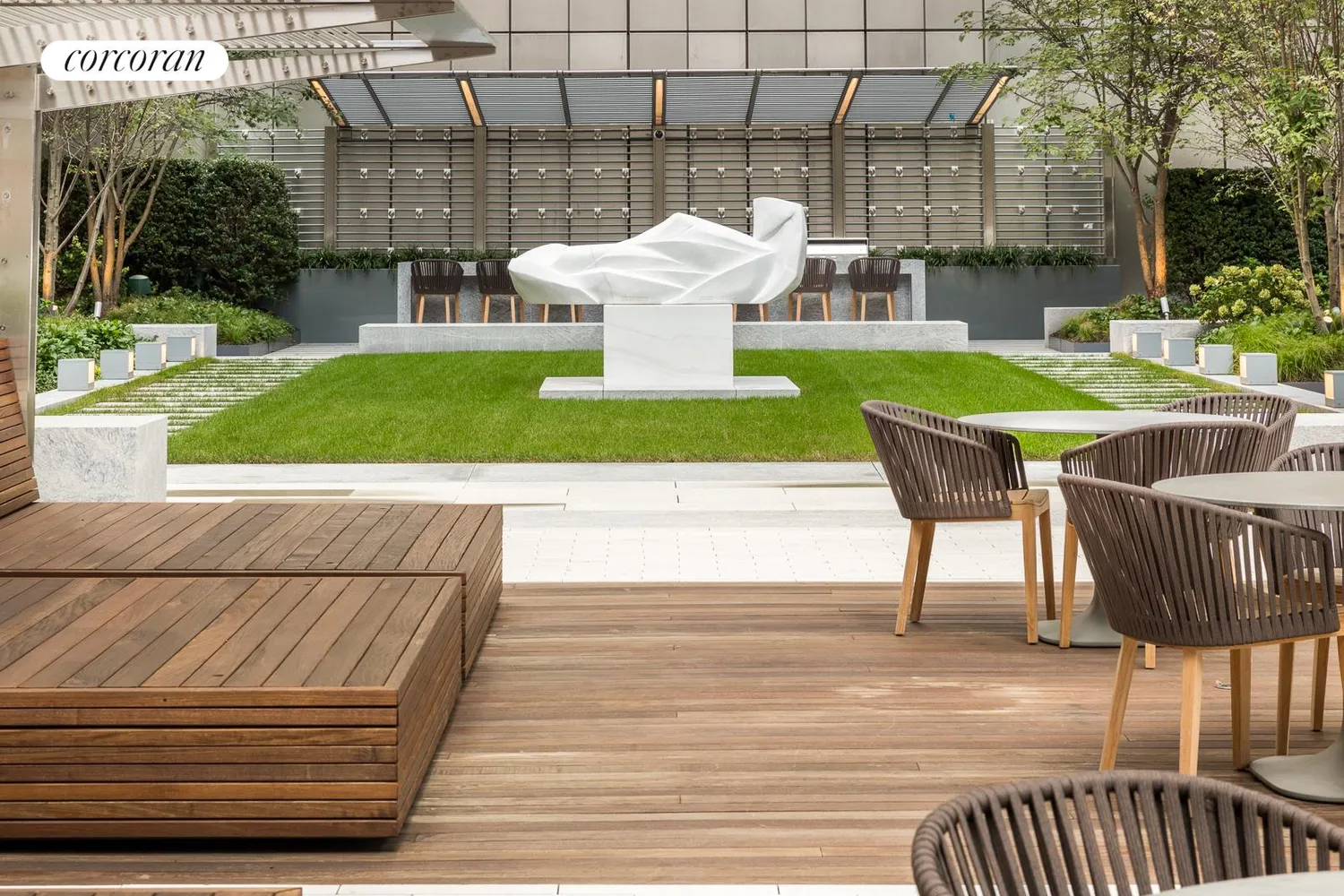 a view of a patio with couches chairs and potted plants