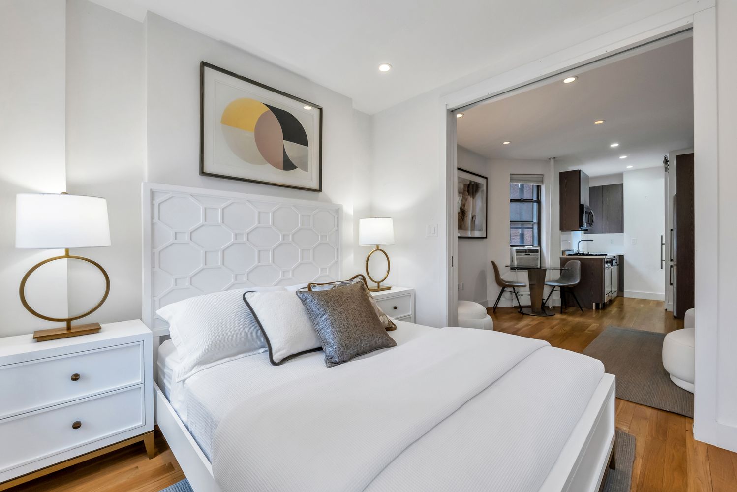 223 West 10th Street, Unit 2C Manhattan, NY 10014 - Photo 2 of 11 a bedroom with bed and wooden floor
