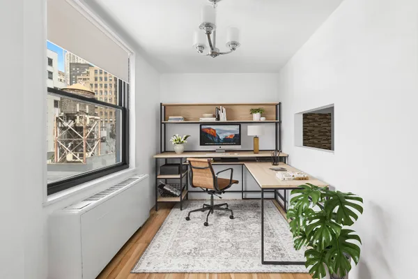 a workspace with furniture and window