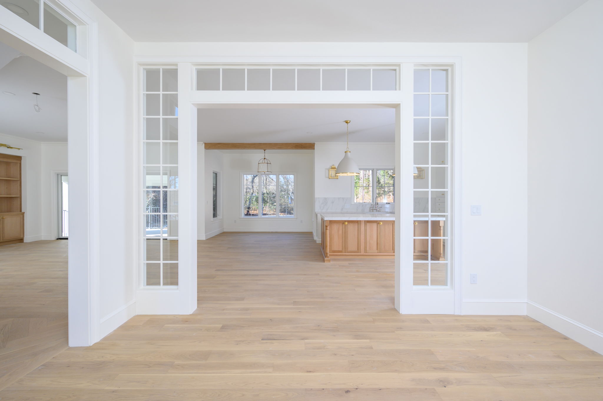 249 Central Avenue Milton, MA 02186 - Photo 9 of 61 a view of a living room with wooden floor and a front door