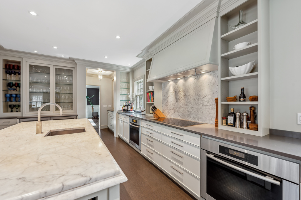 79 Pine Street Dover, MA 02030 - Photo 10 of 25 a large white kitchen with stainless steel appliances granite countertop a stove and a refrigerator