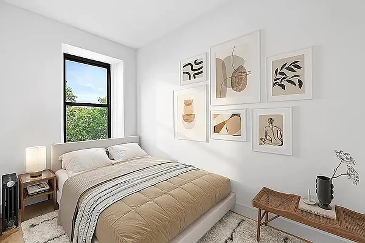 82 Clinton Avenue, Unit 4 Brooklyn, NY 11205 - Photo 4 of 11 a bedroom with a bed and a window