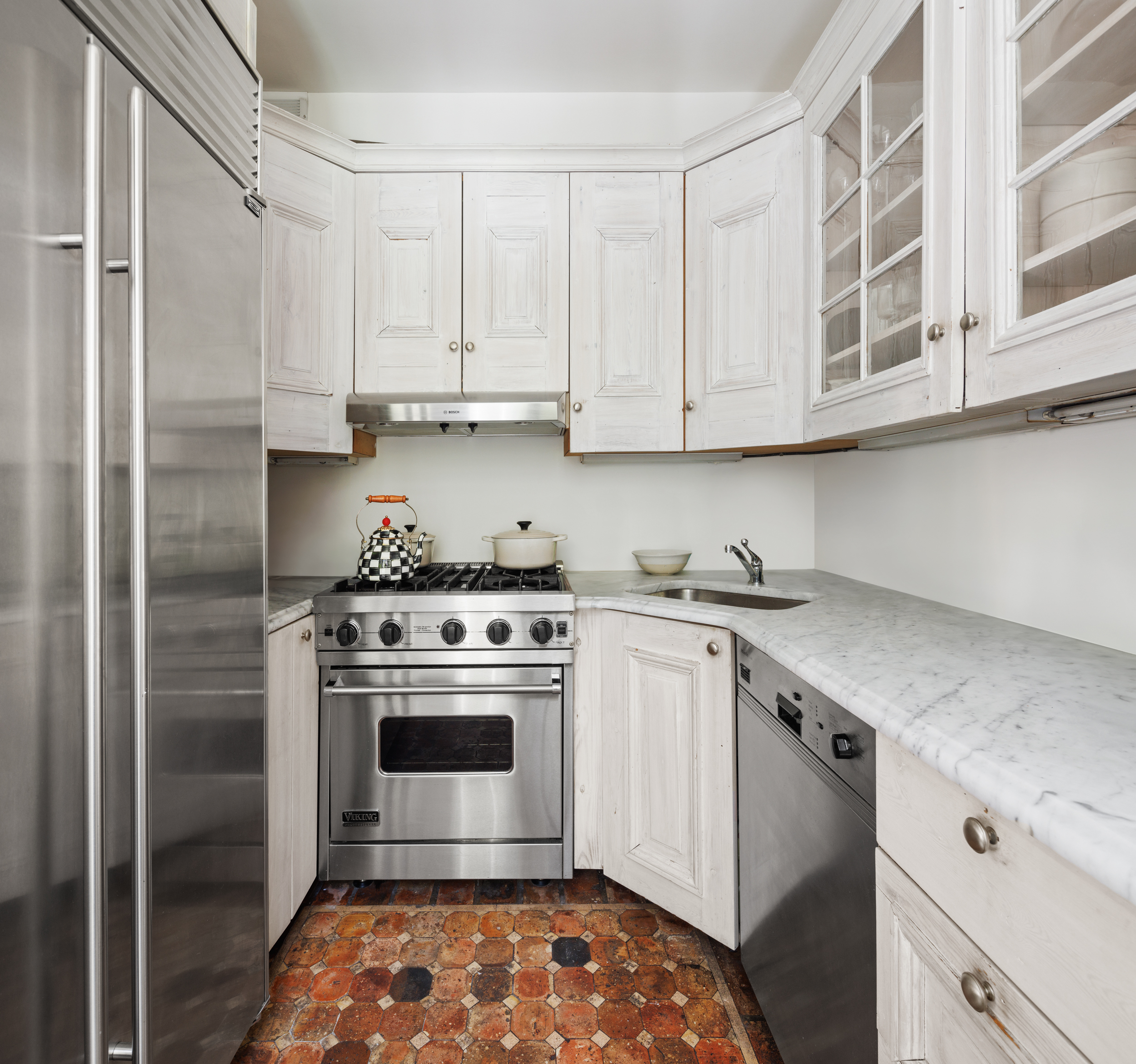 367 Bleecker Street Manhattan, NY 10014 - Photo 5 of 11 a kitchen with stainless steel appliances granite countertop a sink stove and refrigerator