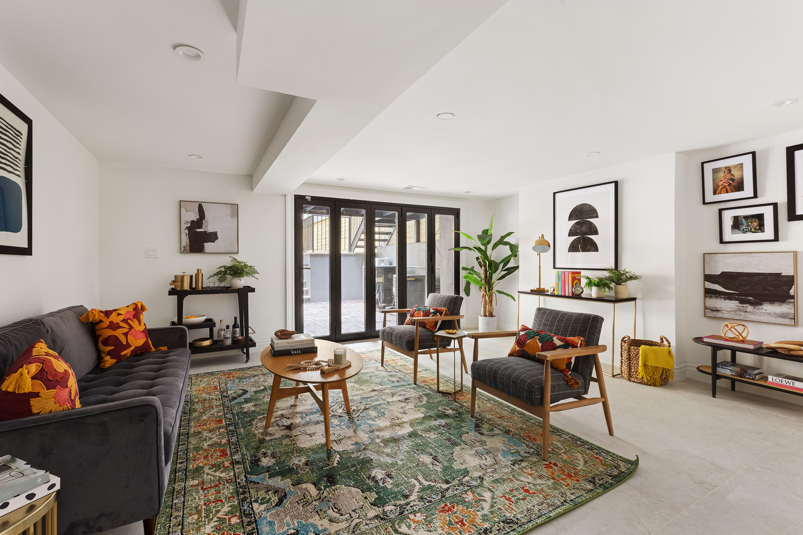 363 Warren Street Brooklyn, NY 11201 - Photo 17 of 23 a living room with furniture and a flat screen tv