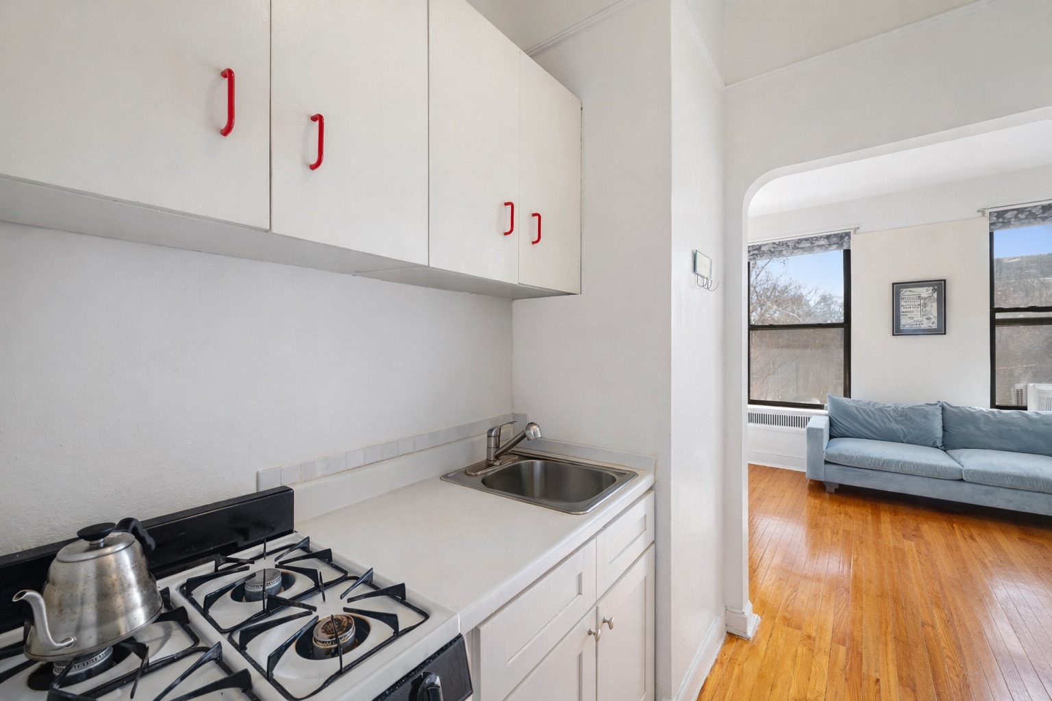 101 West 80th Street, Unit 2C Manhattan, NY 10024 - Photo 2 of 7 a kitchen with a sink and a stove top oven