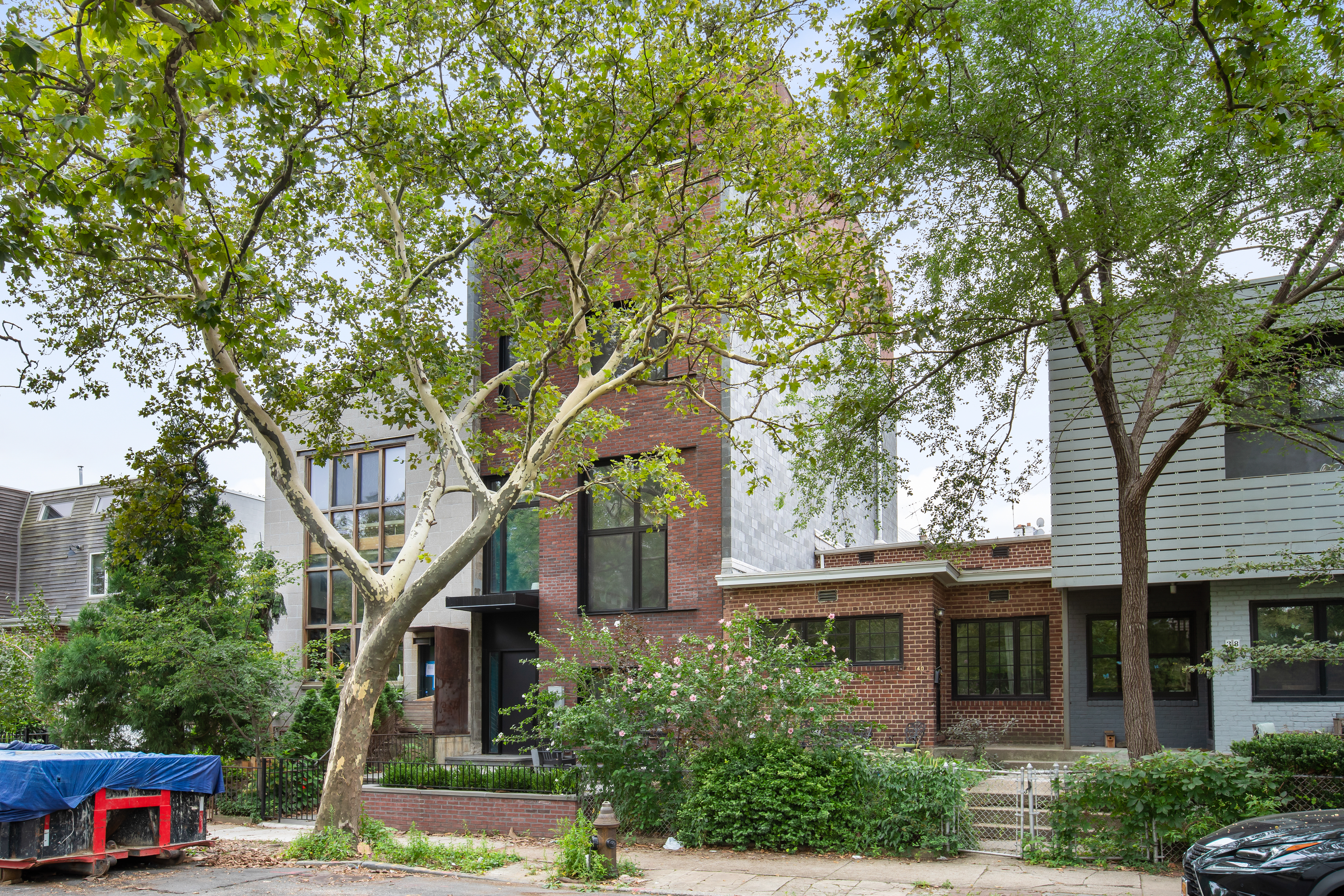 42 Sharon Street Brooklyn, NY 11211 - Photo 27 of 28 front view of a house with a tree