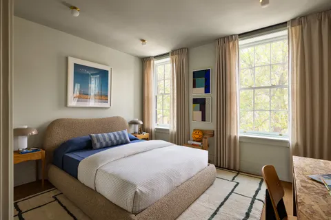 a living room with a couch and a window