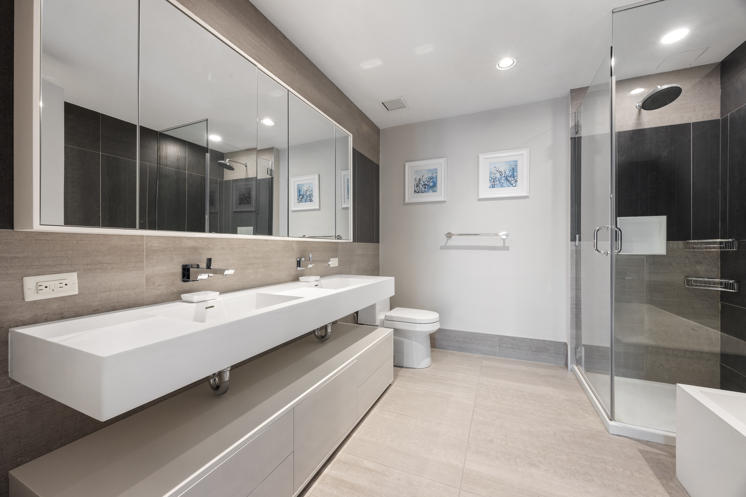 540 West 49th Street, Unit PH1N Manhattan, NY 10019 - Photo 11 of 18 a bathroom with a double vanity sink mirror and toilet