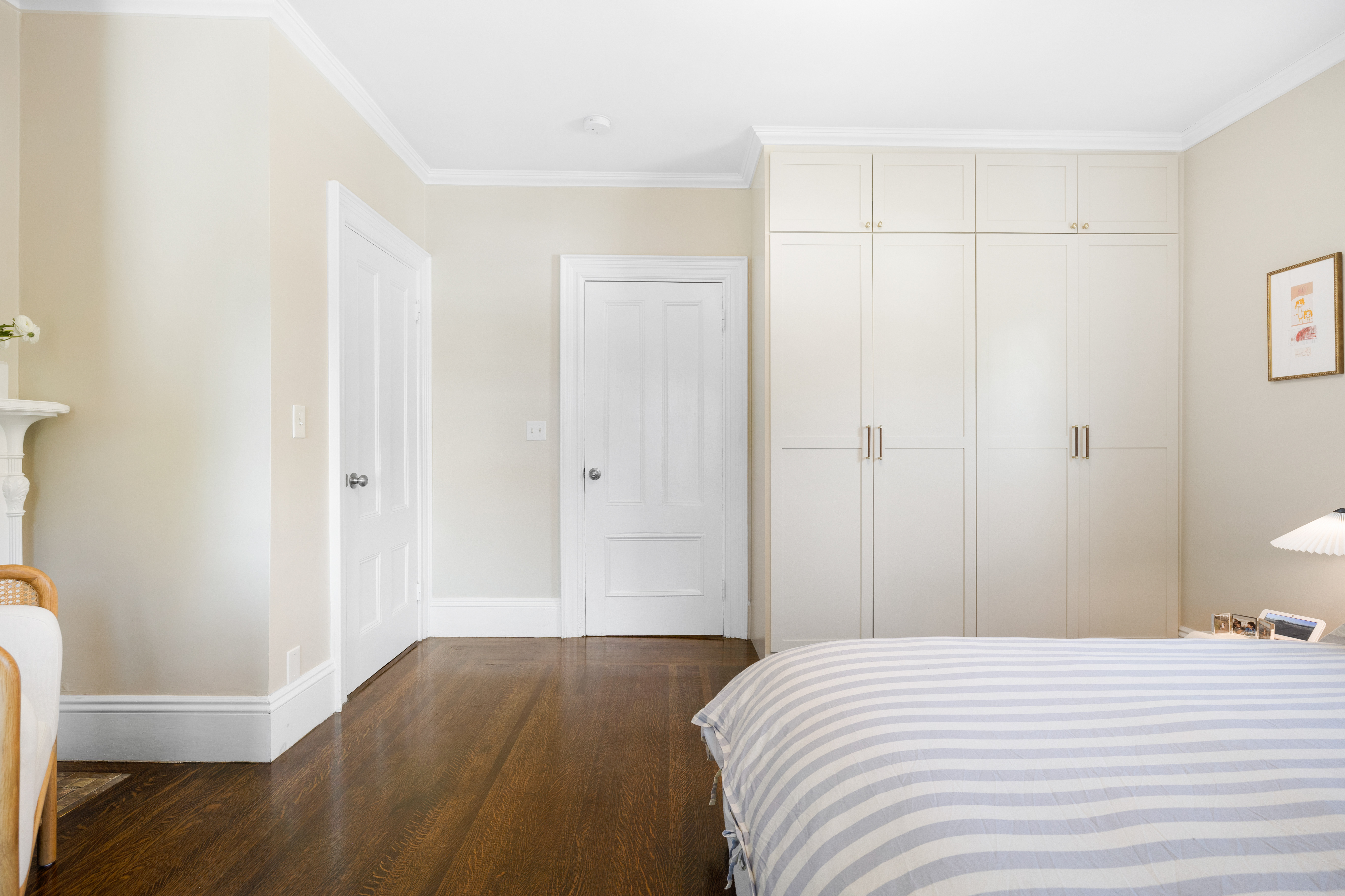 90 Maple Place Dedham, MA 02026 - Photo 21 of 40 a bedroom with a bed and wooden floor