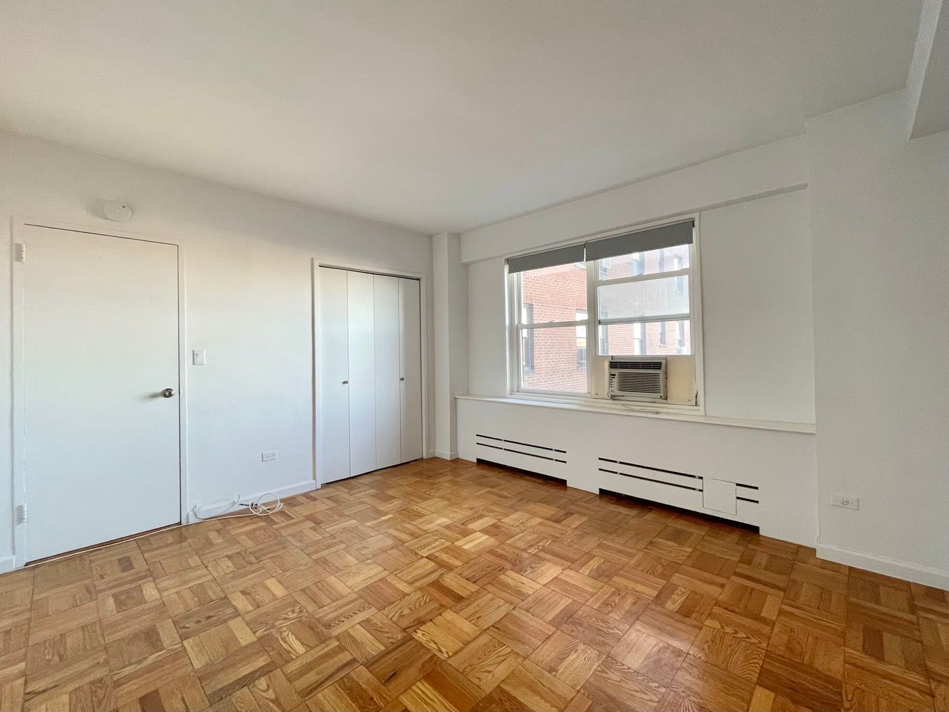 345 West 145th Street, Unit 8A1 Manhattan, NY 10031 - Photo 3 of 7 a view of an empty room with a window