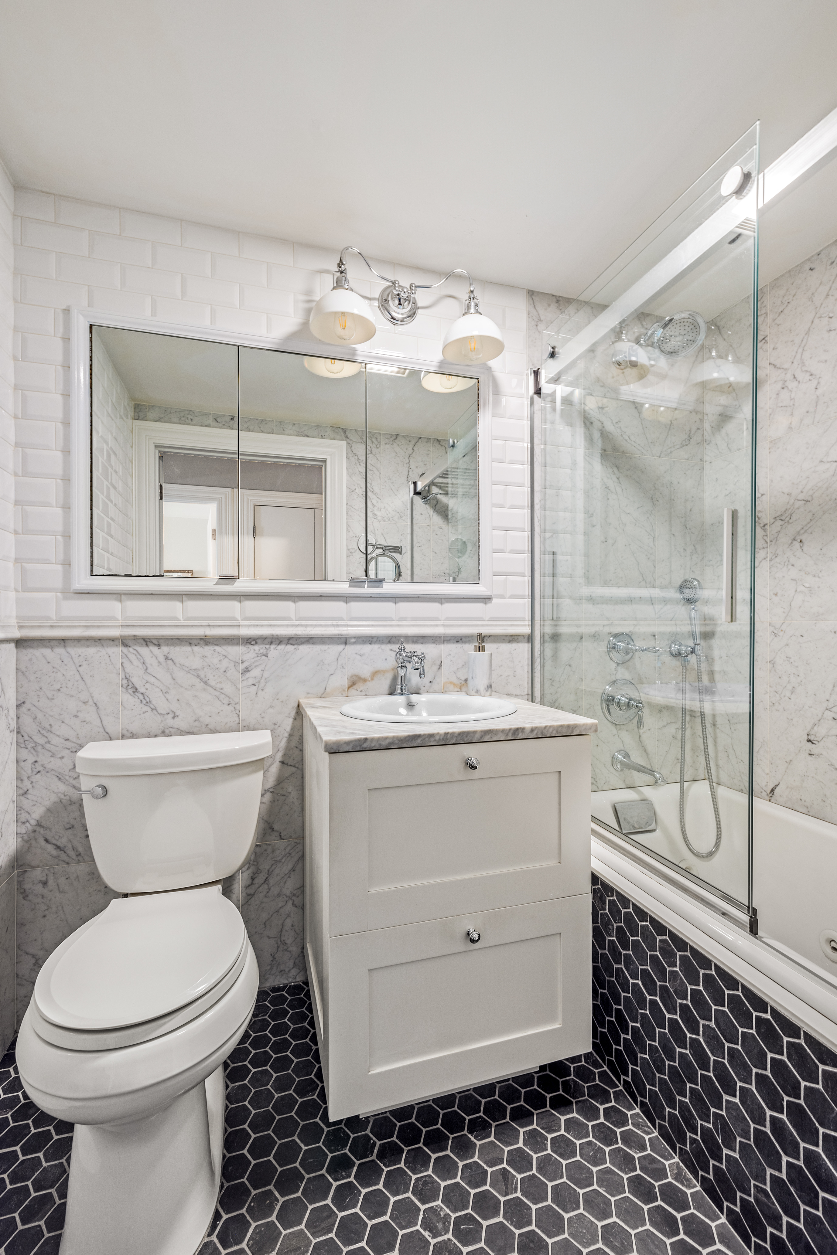 118 Union Street, Unit 9A Brooklyn, NY 11231 - Photo 6 of 10 a bathroom with a sink toilet and shower