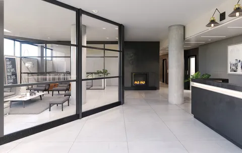 a reading room with furniture and a window