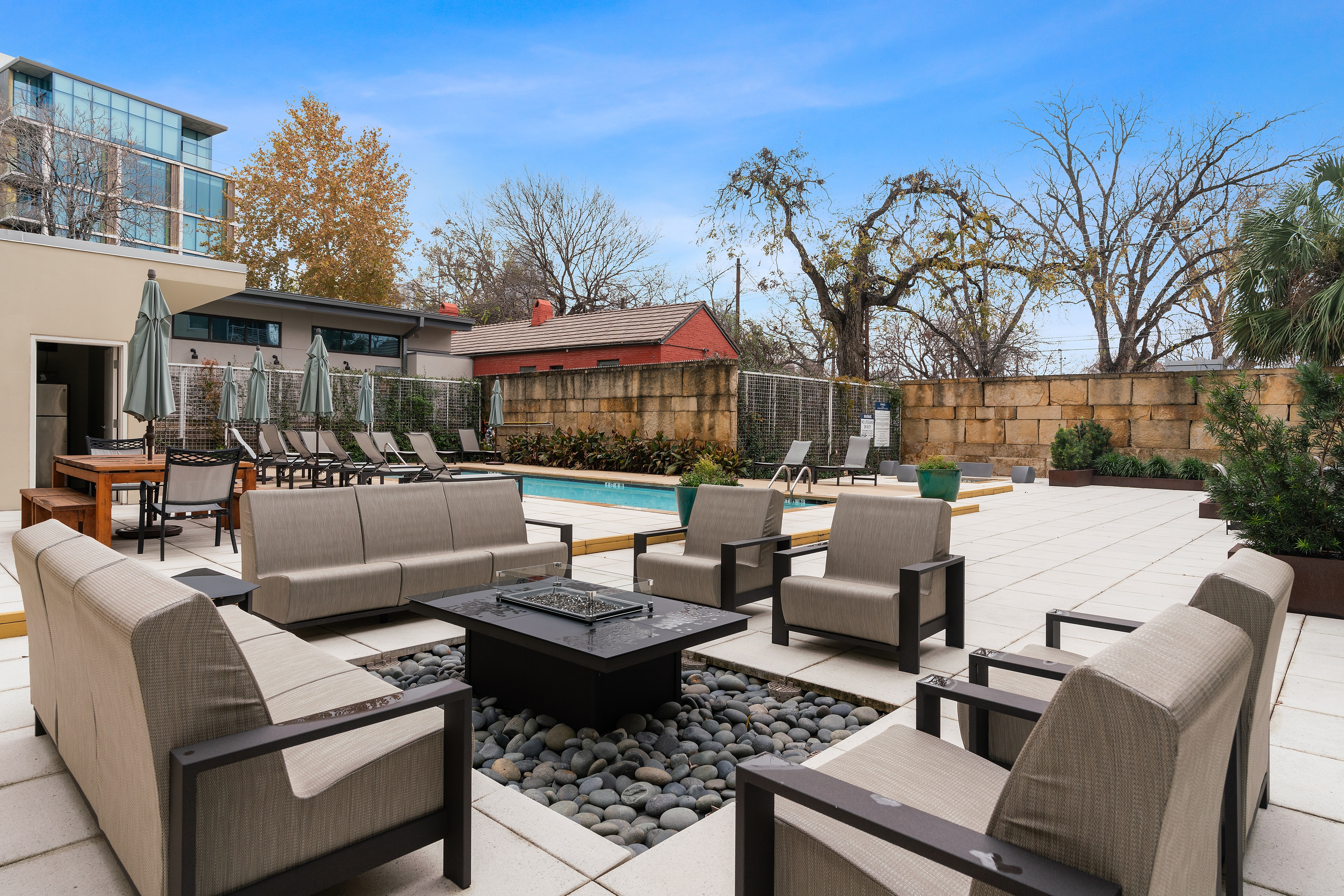 210 Lee Barton Drive, Unit 517 Austin, TX 78704 - Photo 24 of 32 a outdoor space with patio the couches and a potted plant on the table