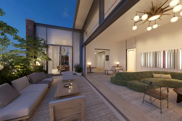 a living room with furniture and a chandelier