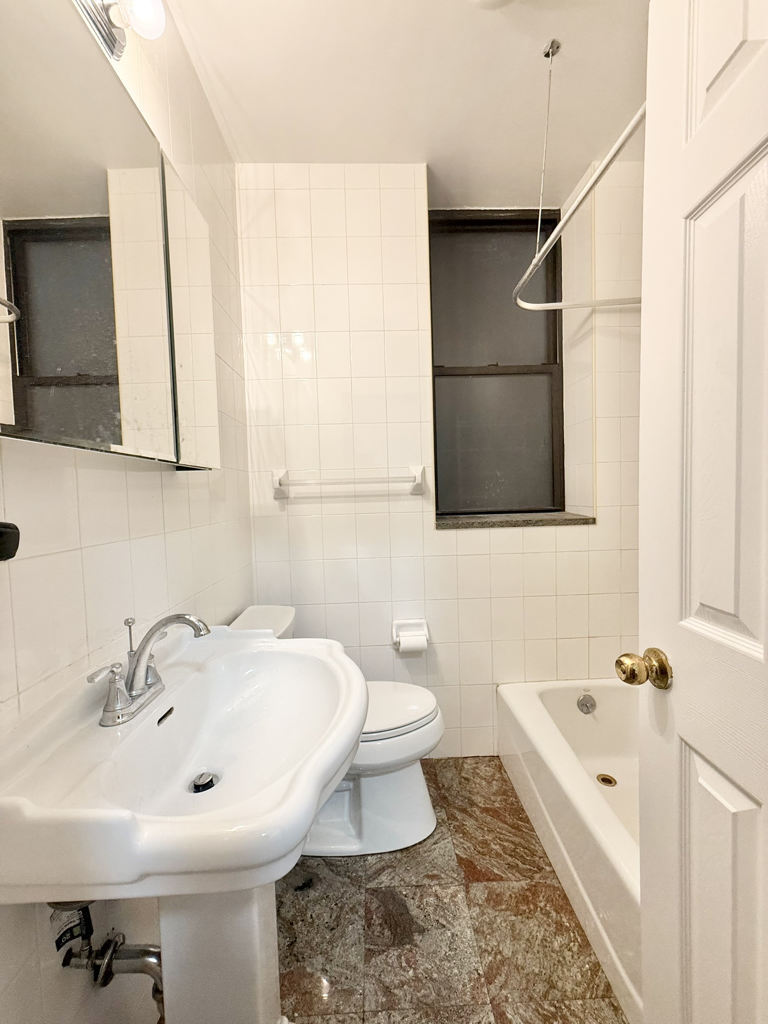 839 West End Avenue, Unit 3D Manhattan, NY 10025 - Photo 8 of 10 a bathroom with a sink toilet and shower