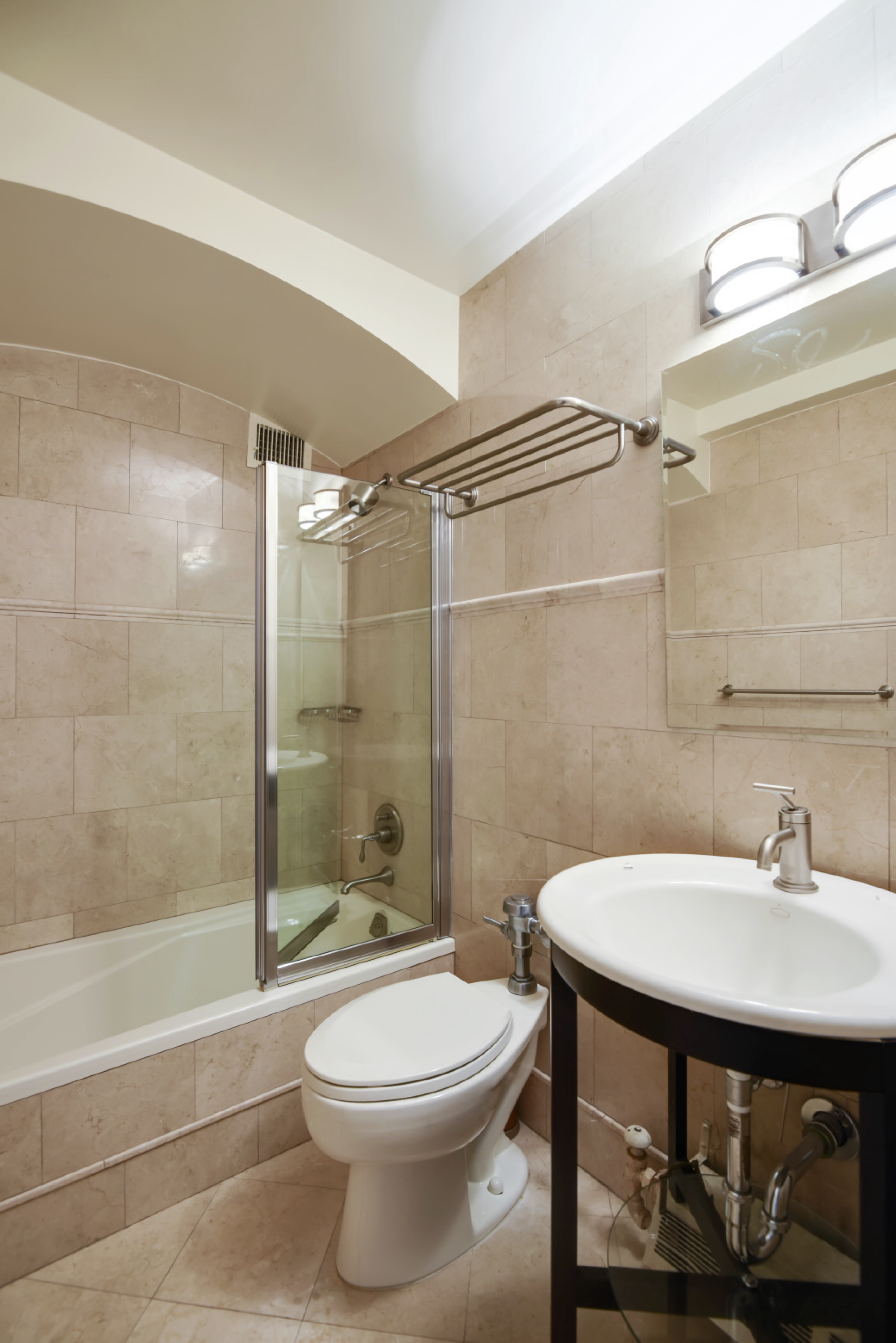 923 5th Avenue, Unit 8F Manhattan, NY 10021 - Photo 7 of 8 a bathroom with a sink toilet and shower
