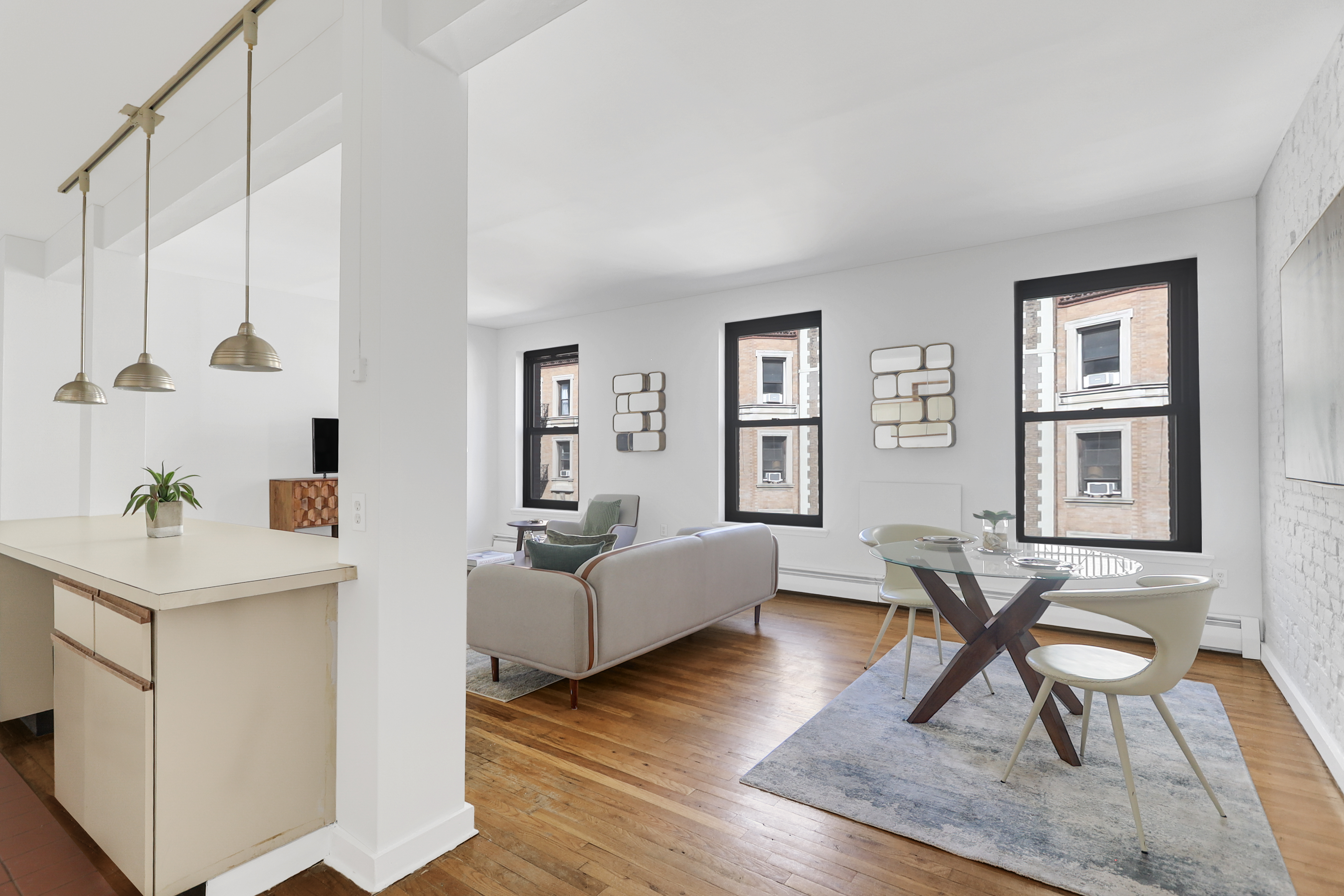 314 West 94th Street, Unit 5D Manhattan, NY 10025 - Photo 3 of 13 a living room with furniture and wooden floor