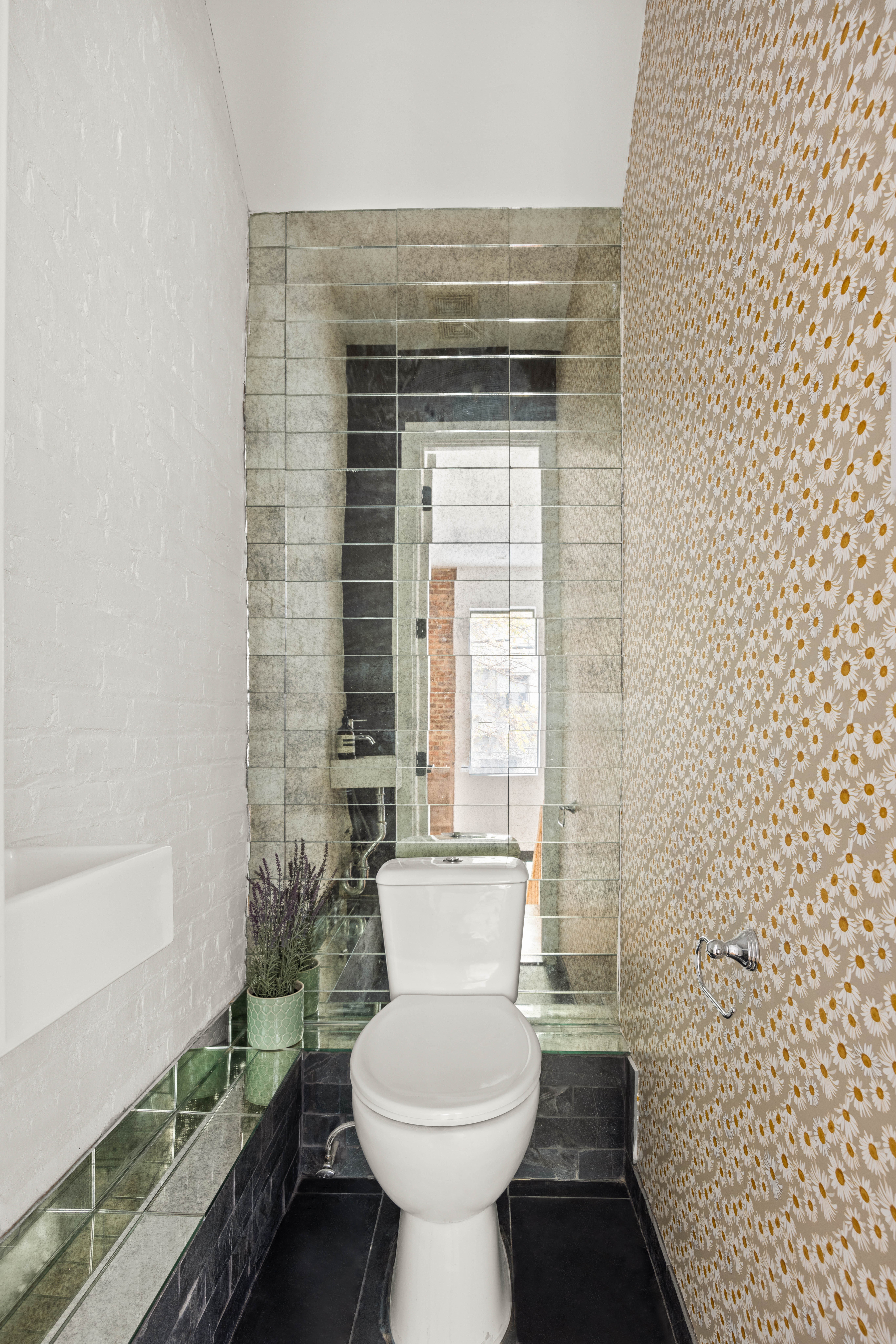 750 Lincoln Place Brooklyn, NY 11216 - Photo 18 of 24 a bathroom with a toilet a sink and a bathtub