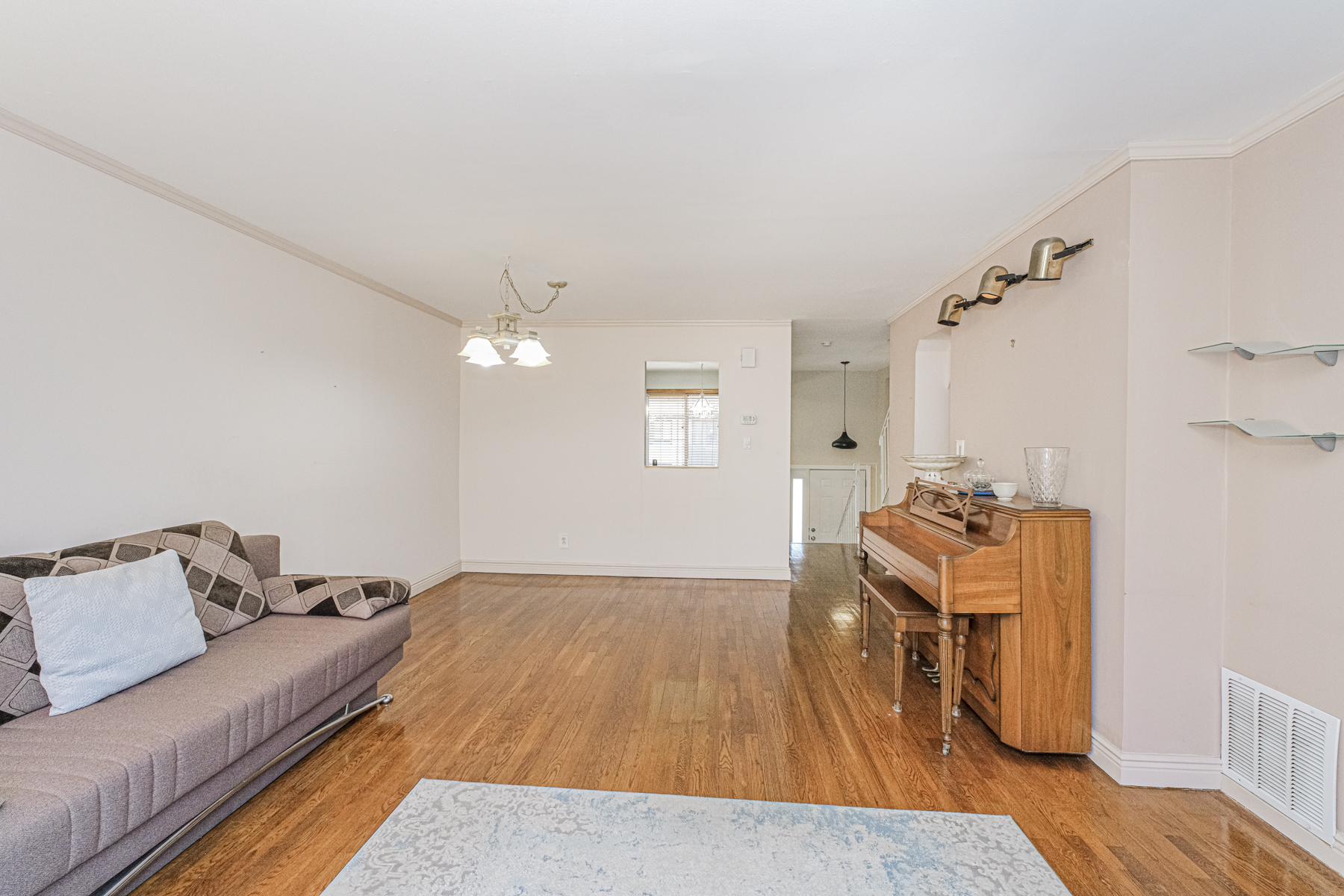 97 Dogwood Lane Staten Island, NY 10305 - Photo 5 of 22 a living room with furniture and a wooden floor