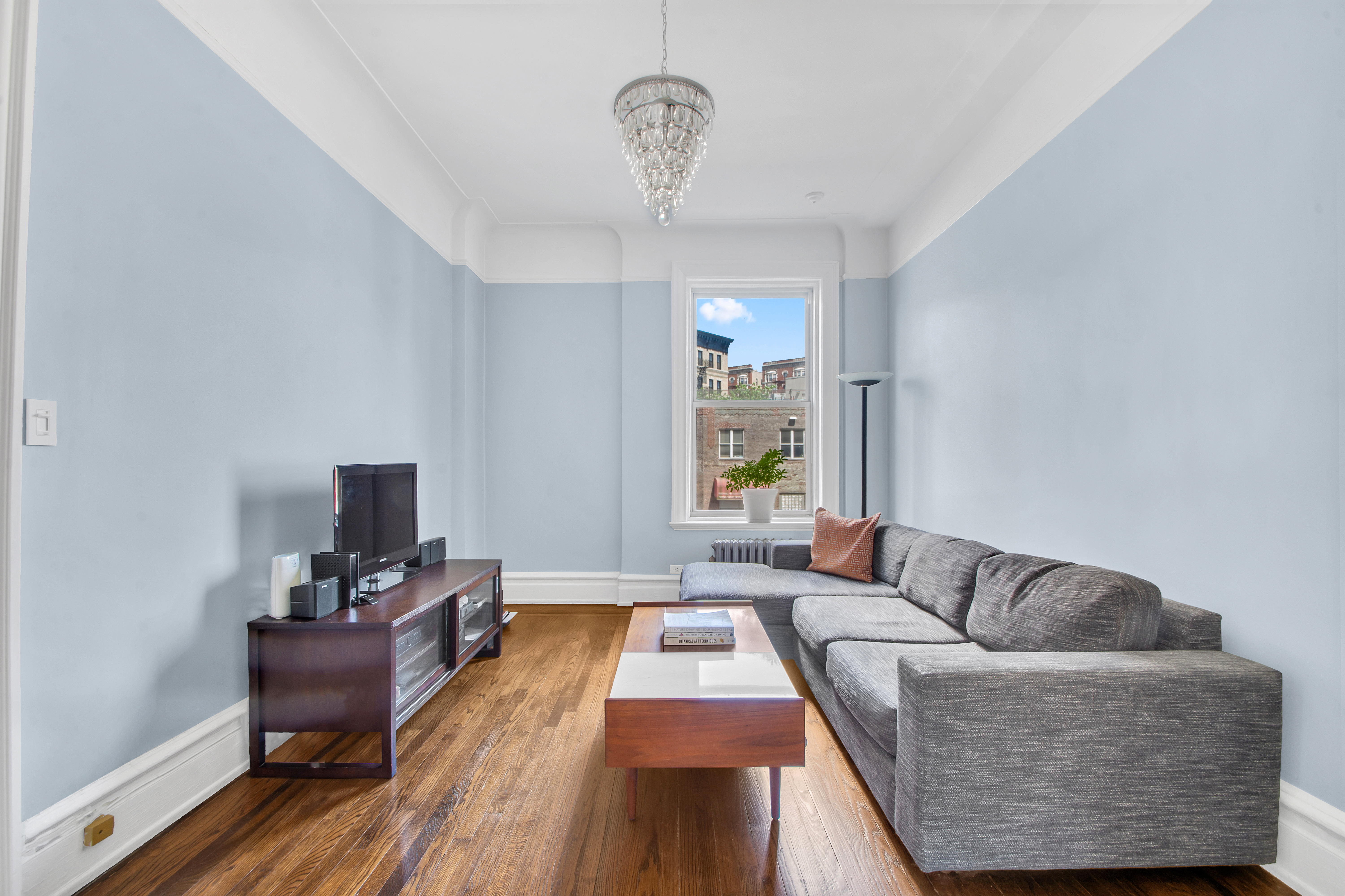 800 Riverside Drive, Unit 2E Manhattan, NY 10032 - Photo 16 of 27 a living room with furniture and a window