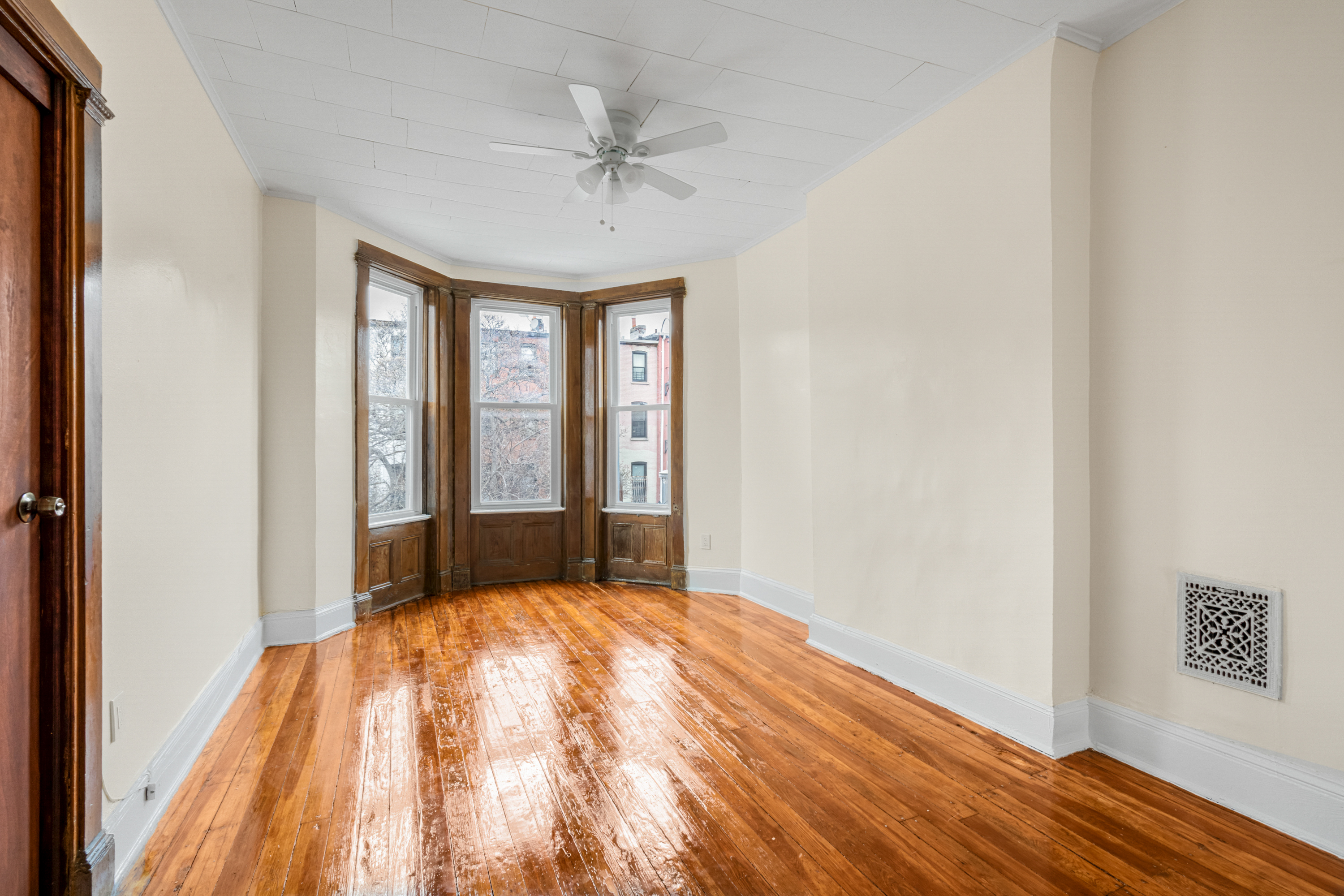 601 Jefferson Avenue, Unit 2 Brooklyn, NY 11221 - Photo 4 of 8 a view of room with window and hardwood floor