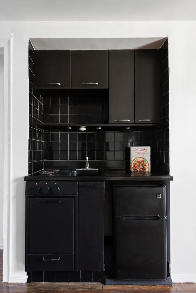 a kitchen with a sink and cabinets