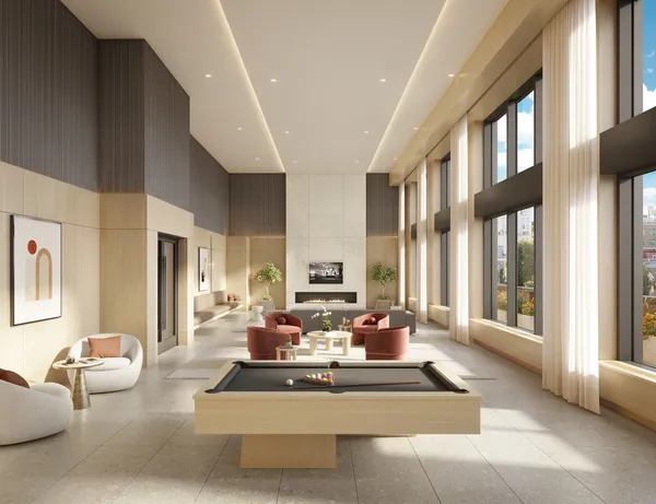 a living room with furniture and large windows