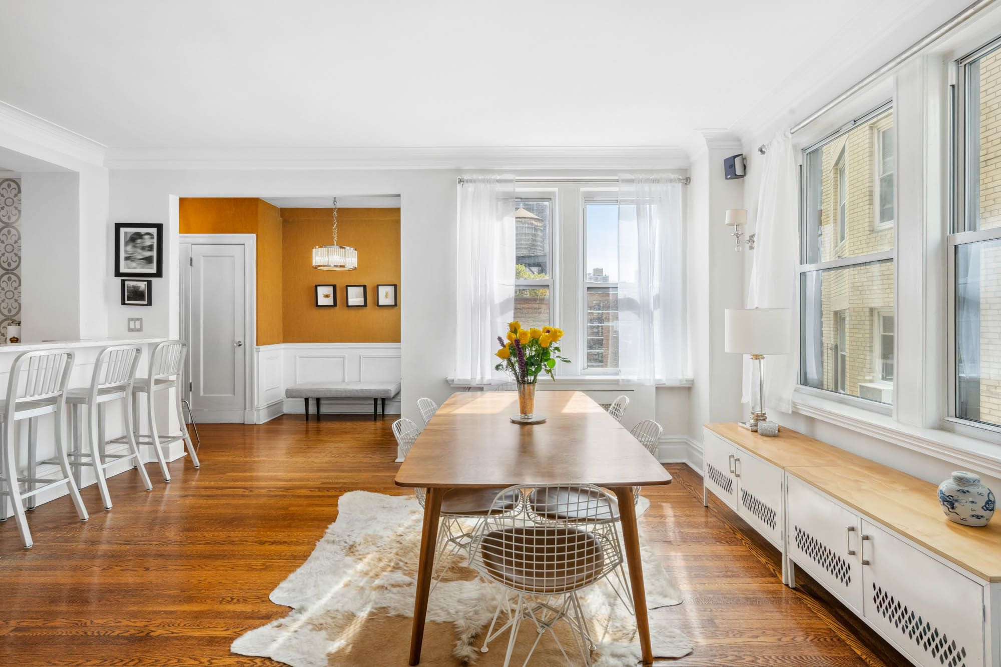 136 East 36th Street, Unit 9/10C Manhattan, NY 10016 - Photo 2 of 23 a very nice looking living room with a large window and wooden floor