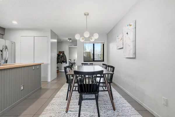 a kitchen with stainless steel appliances a refrigerator and microwave