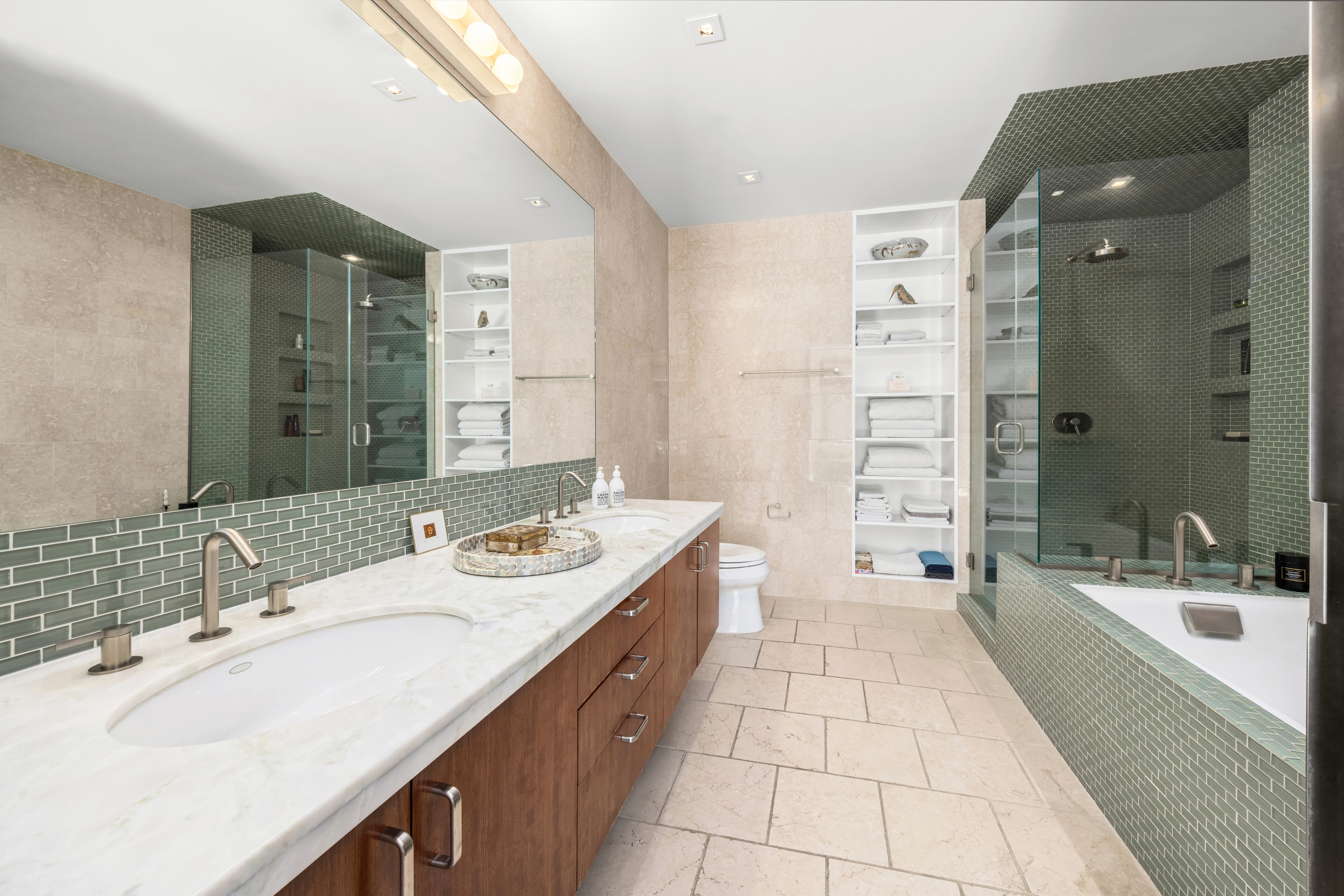 138 Reade Street, Unit 5 Manhattan, NY 10013 - Photo 15 of 23 a spacious bathroom with a double vanity sink mirror double and shower