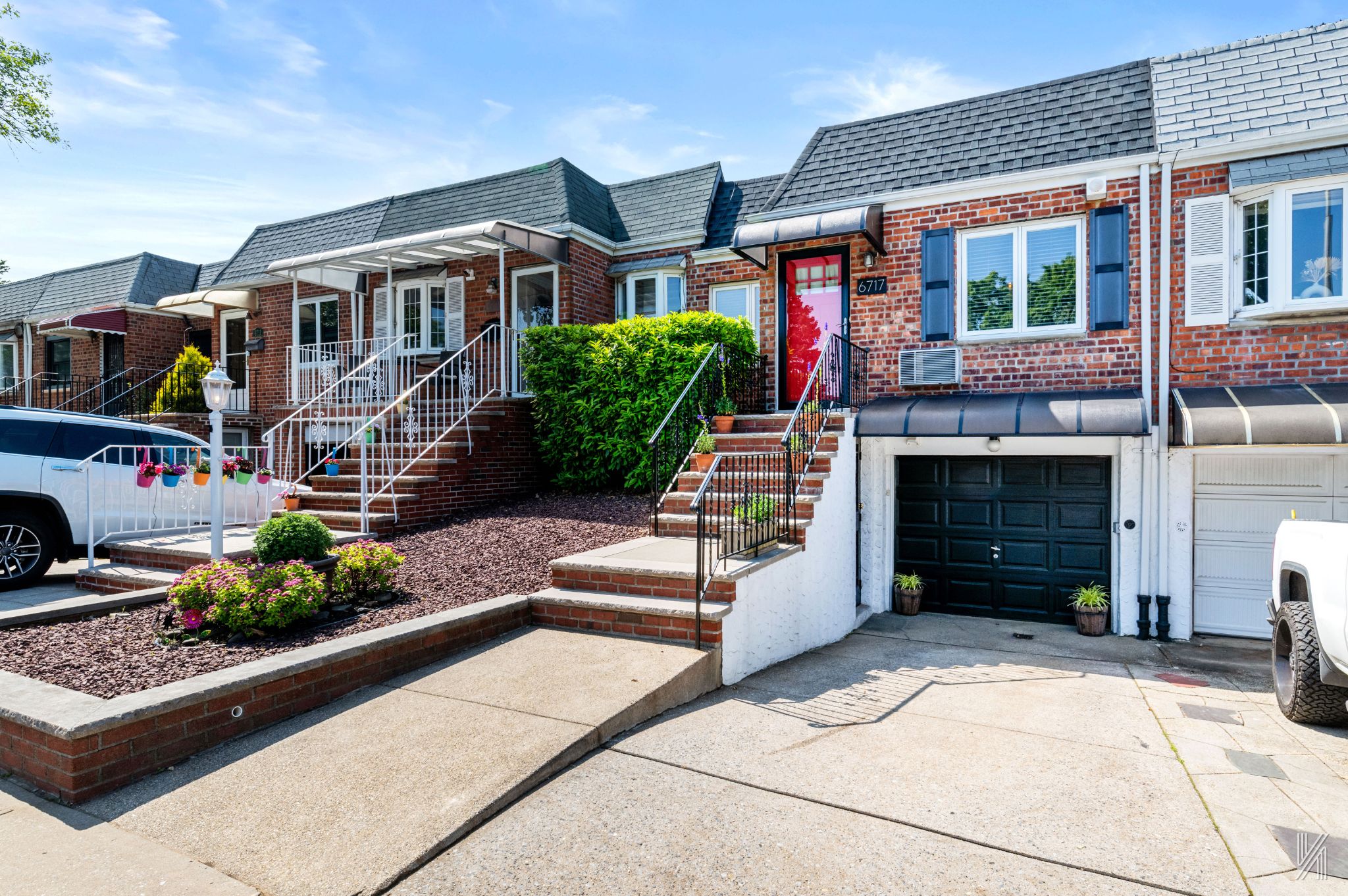 67-17 Eliot Avenue Queens, NY 11379 - Photo 2 of 21 a front view of a house with a garden