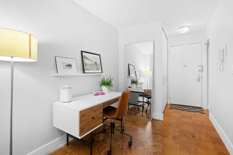 a workspace with furniture and window