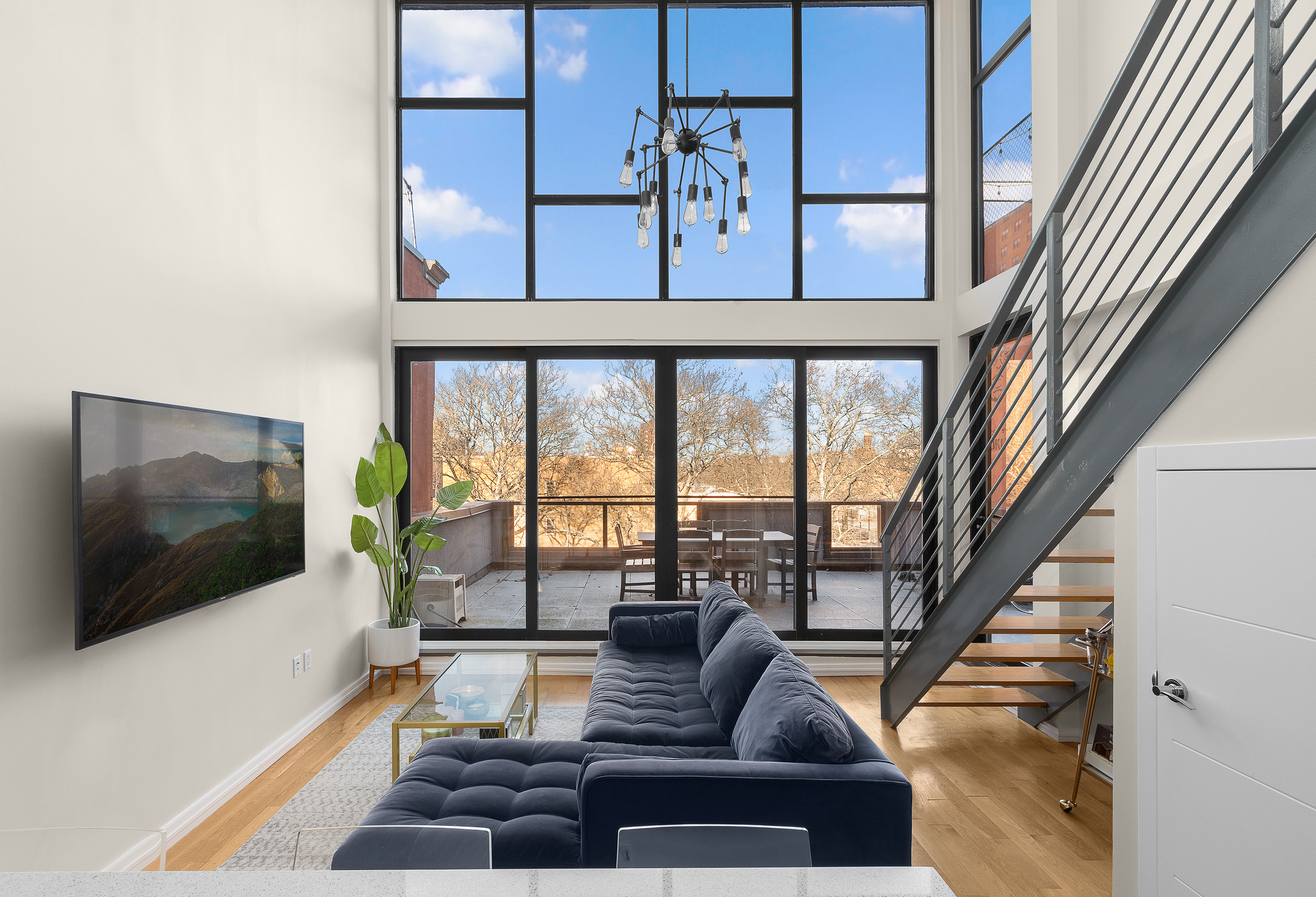 364 Lafayette Avenue, Unit 4A Brooklyn, NY 11238 - Photo 1 of 12 a living room with furniture and a flat screen tv