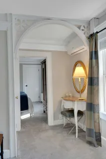 a front view of a house with outdoor seating