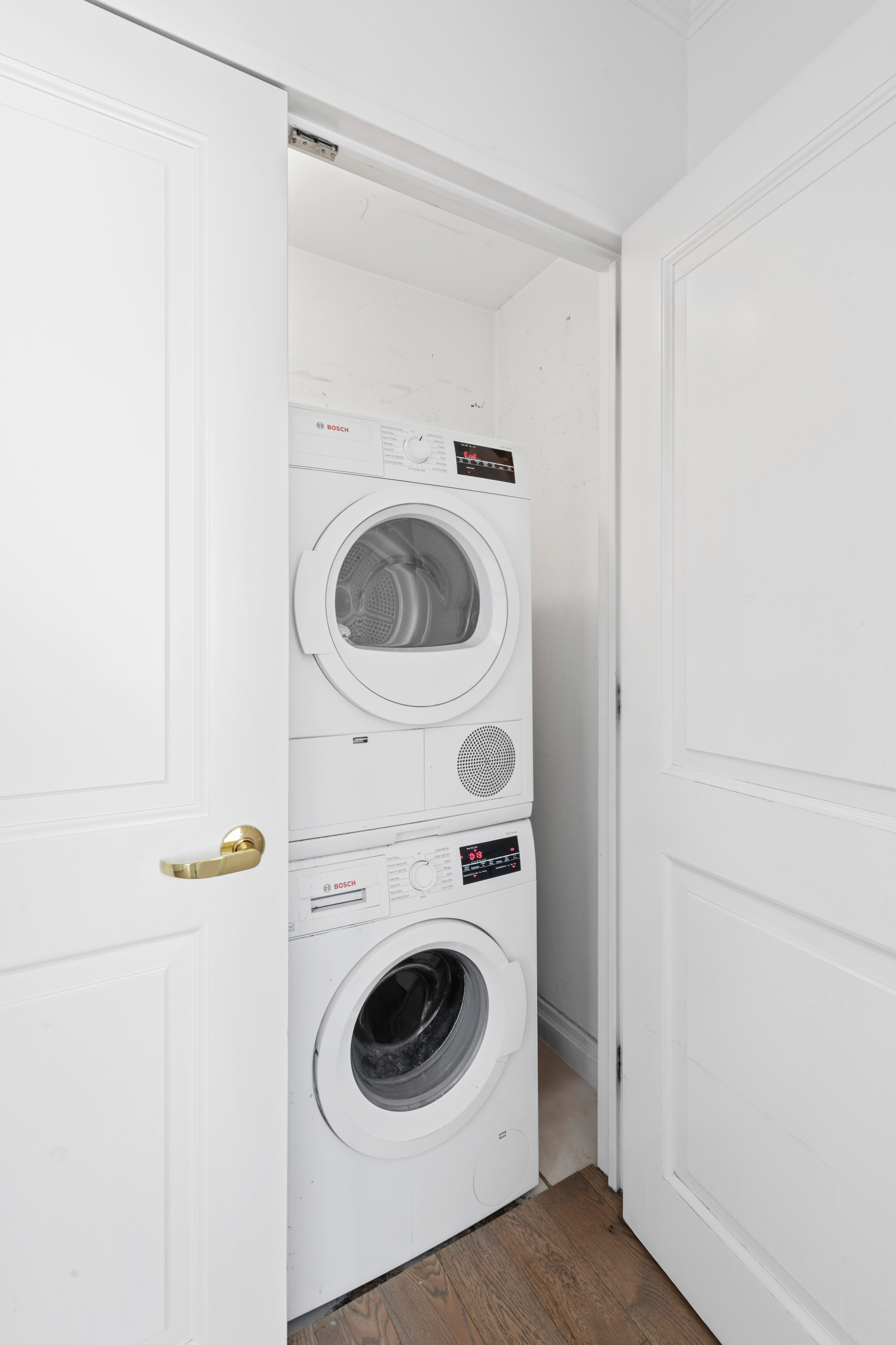 404 East 76th Street, Unit 8A Manhattan, NY 10021 - Photo 13 of 17 a utility room with dryer and washer