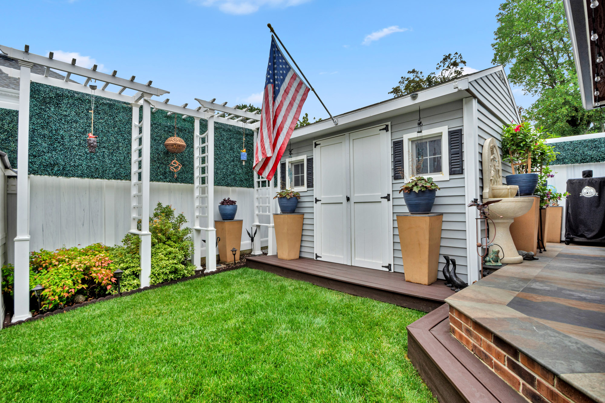 909 Jewett Avenue Staten Island, NY 10314 - Photo 53 of 65 a view of a house with backyard and porch