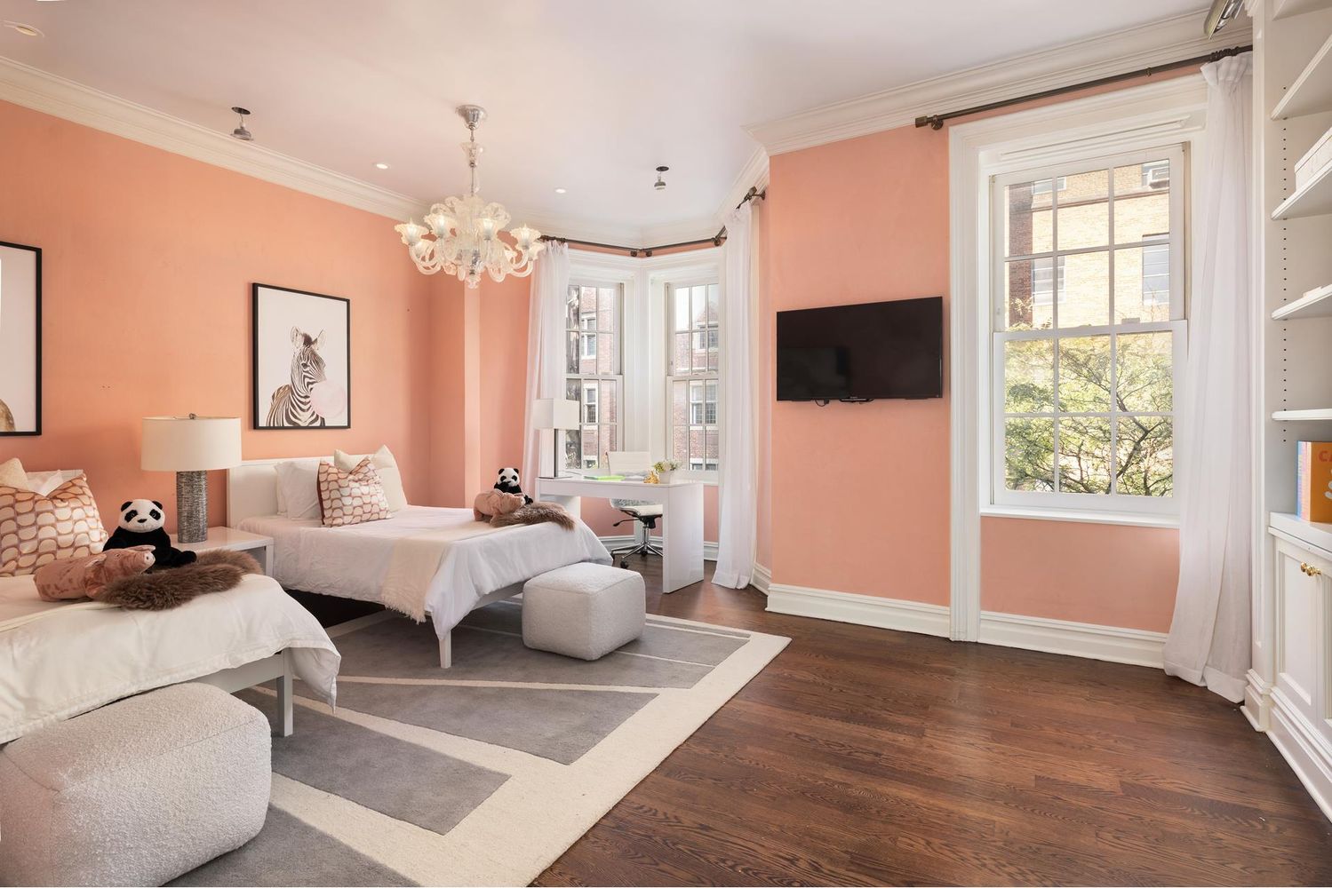 136 East 65th Street Manhattan, NY 10065 - Photo 11 of 20 a living room with furniture and a flat screen tv