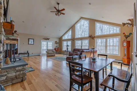 a kitchen with stainless steel appliances granite countertop a refrigerator a stove and a sink with cabinets