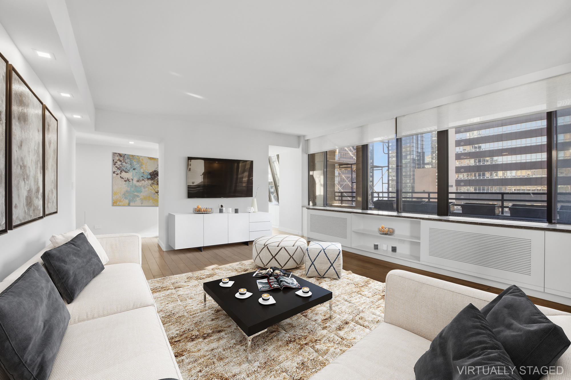 309 East 49th Street, Unit 21A Manhattan, NY 10017 - Photo 3 of 18 a living room with furniture and a flat screen tv