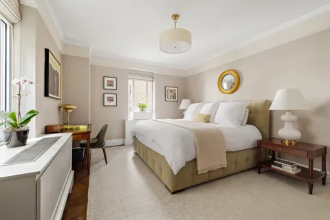 a bedroom with a bed and a table in it