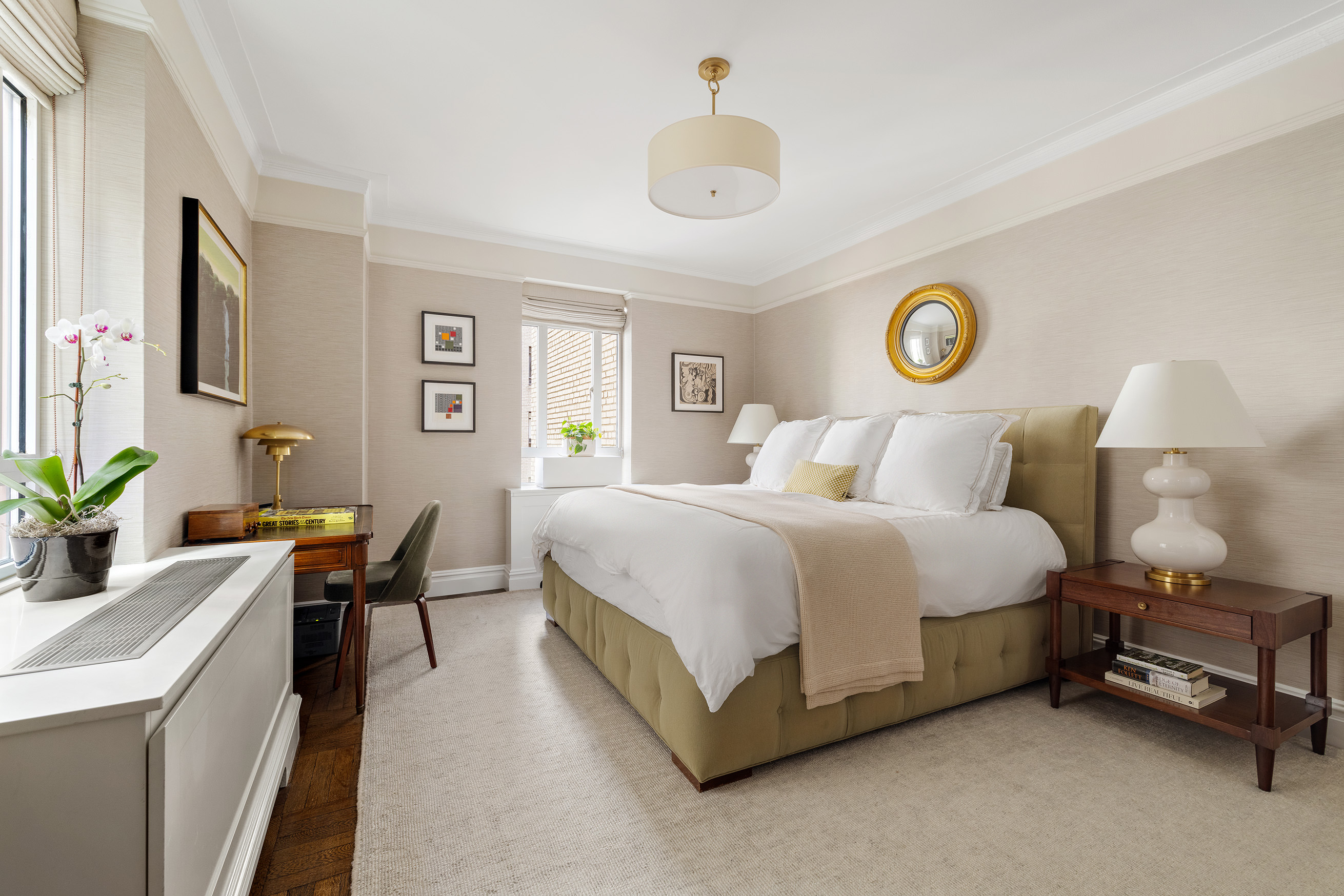 25 Central Park West, Unit 3A Manhattan, NY 10023 - Photo 8 of 11 a bedroom with a bed and a table in it