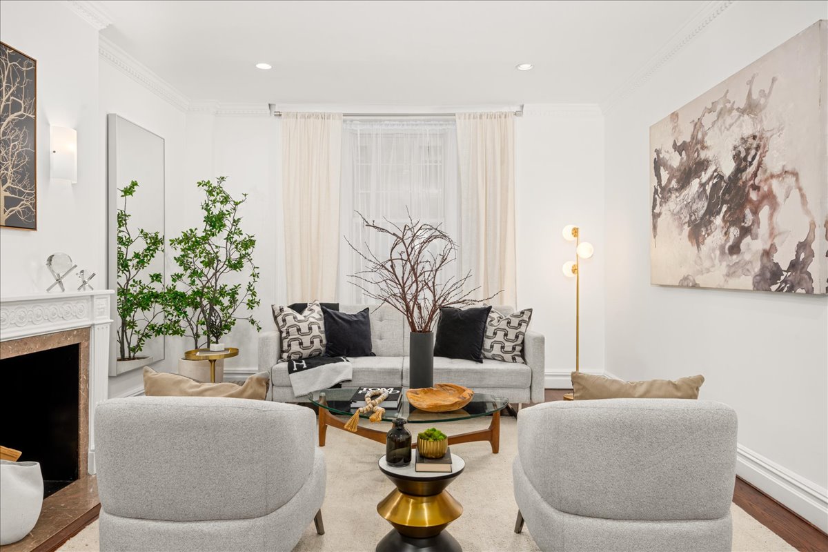 a living room with furniture and a fireplace
