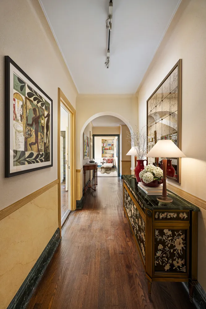 a dining room with furniture and wooden floor